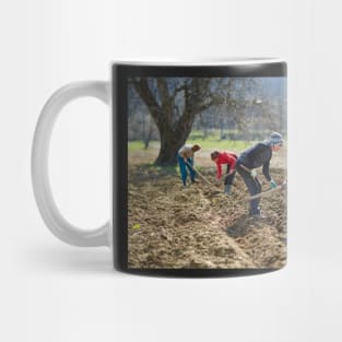 Sowing potatoes Mug